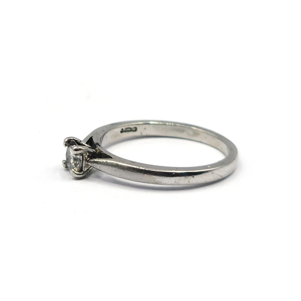 Platinum 0.30 carat solitaire brilliant cut diamond ring with a sleek band and sparkling center stone.