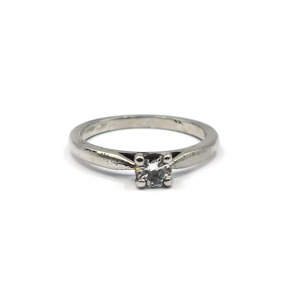 Platinum 0.30 carat solitaire brilliant cut diamond ring with a sleek band and a sparkling central diamond.