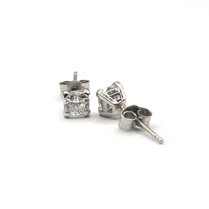 Platinum 1.00 carat GIA certified diamond stud earrings with color G and clarity VS2, featuring classic solitaire design.