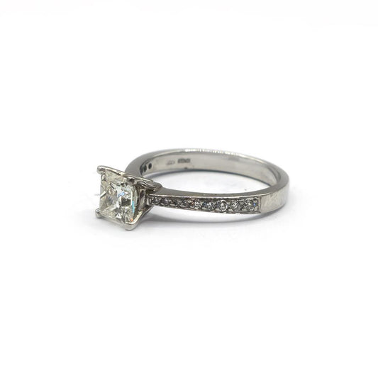 Platinum 1.00 carat princess cut diamond ring with a sleek band, showcasing a sparkling square-shaped diamond setting.