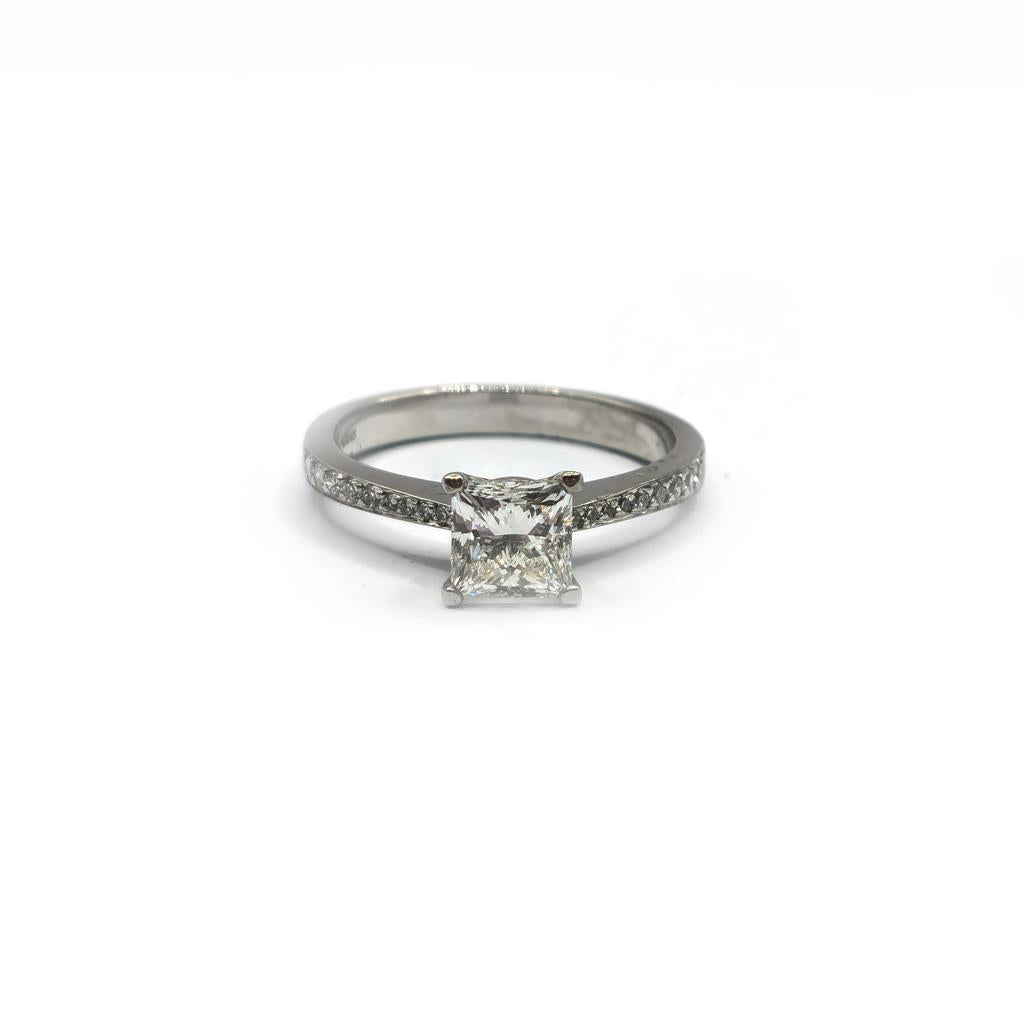 Platinum 1.00 carat princess cut diamond ring with a sleek band and sparkling center stone.