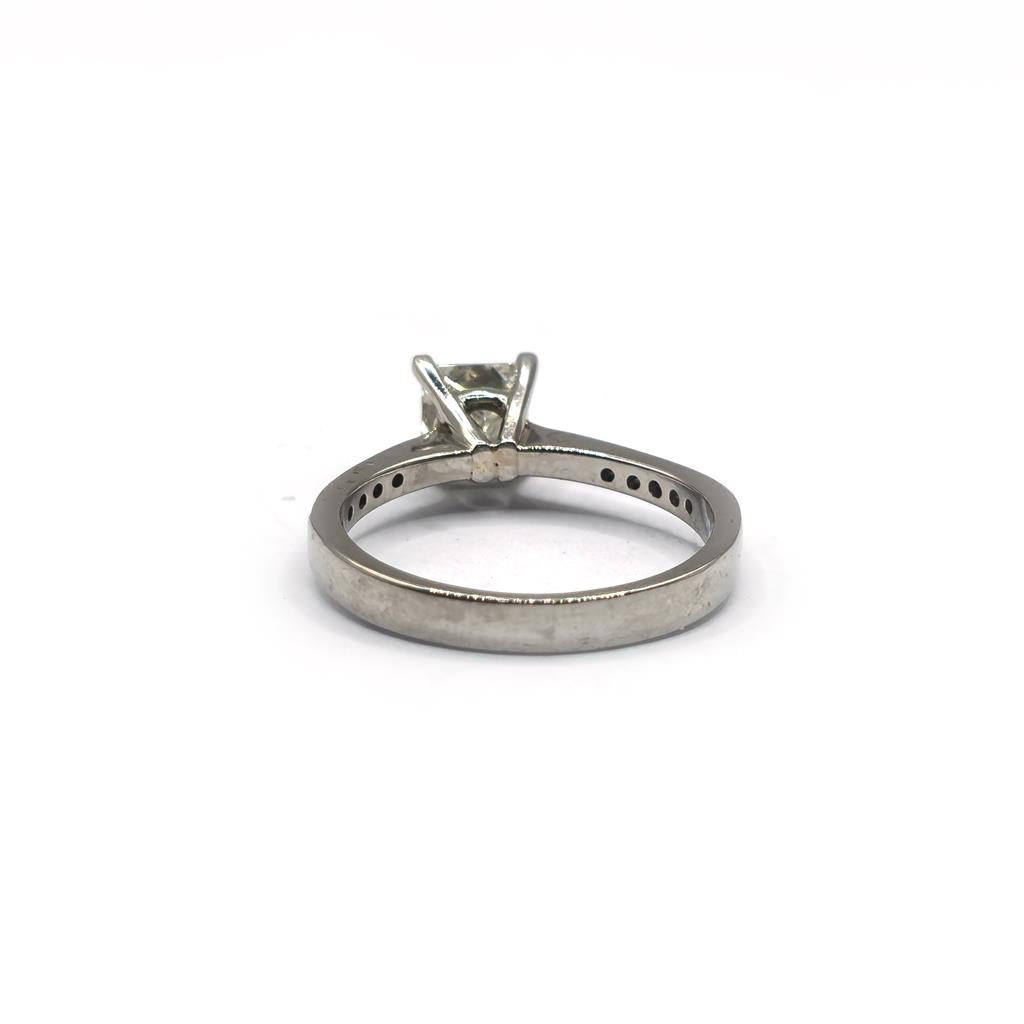 Platinum 1.00 carat princess cut diamond ring with a sleek band and sparkling center stone, showcasing elegance and craftsmanship.