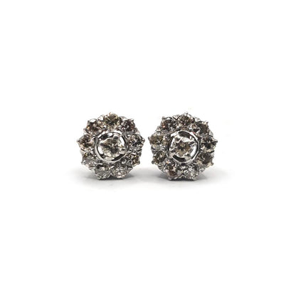 Platinum 1.40 carat diamond stud earrings with round-cut diamonds and secure post backs.