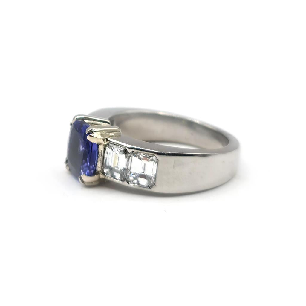 Platinum ring featuring a 1.79 carat tanzanite gemstone and 1.60 carat diamonds, elegant jewelry with a sparkling central stone.