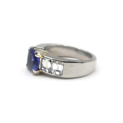 Platinum ring featuring a 1.79 carat tanzanite gemstone and 1.60 carat diamonds, elegant jewelry with a sparkling central stone.