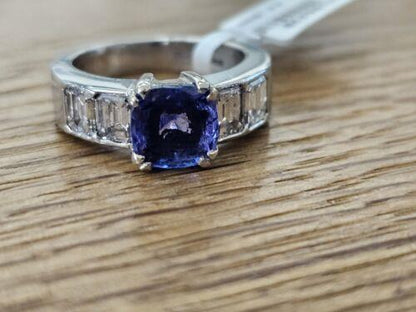Platinum ring featuring a 1.79 carat tanzanite gemstone and 1.60 carat diamonds, elegant jewelry with intricate setting.
