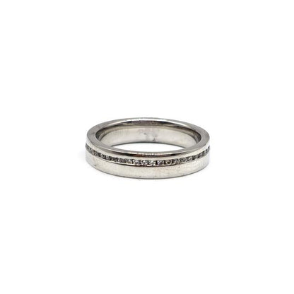 Platinum diamond ring with a central sparkling diamond, elegant design, unbranded jewelry, suitable for special occasions.