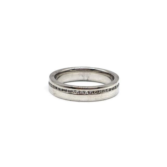 Platinum diamond ring with a central sparkling diamond, elegant design, unbranded jewelry, suitable for special occasions.