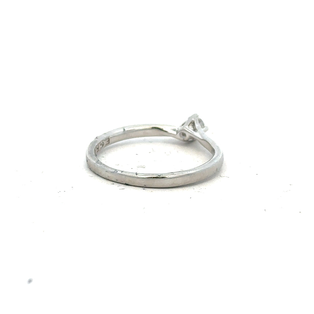 Unbranded platinum diamond ring with box set, size small, featuring a sparkling diamond on a sleek platinum band.