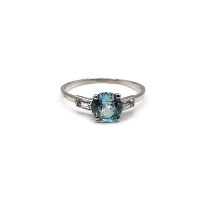 Platinum topaz and cubic zirconia ring featuring a large central gemstone and sparkling side stones, elegant jewelry accessory.