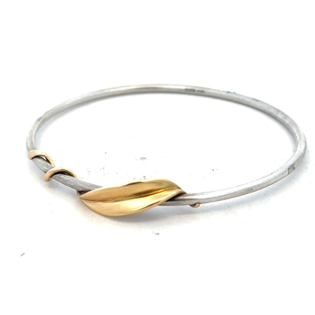 Silver bangle weighing 13.3g, unbranded jewelry accessory with a sleek, polished finish, suitable for everyday wear.