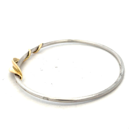 Silver bangle weighing 13.3g, unbranded, featuring a smooth, polished surface and classic design suitable for everyday wear.
