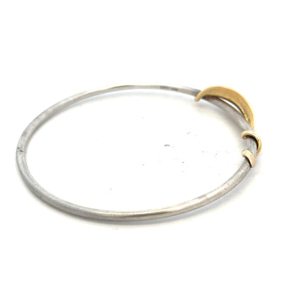 Silver bangle weighing 13.3g with a smooth, polished finish, designed for elegant wristwear.