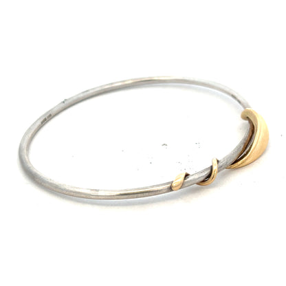 Silver bangle weighing 13.3g, featuring a smooth, polished surface and simple design, displayed on a white background.