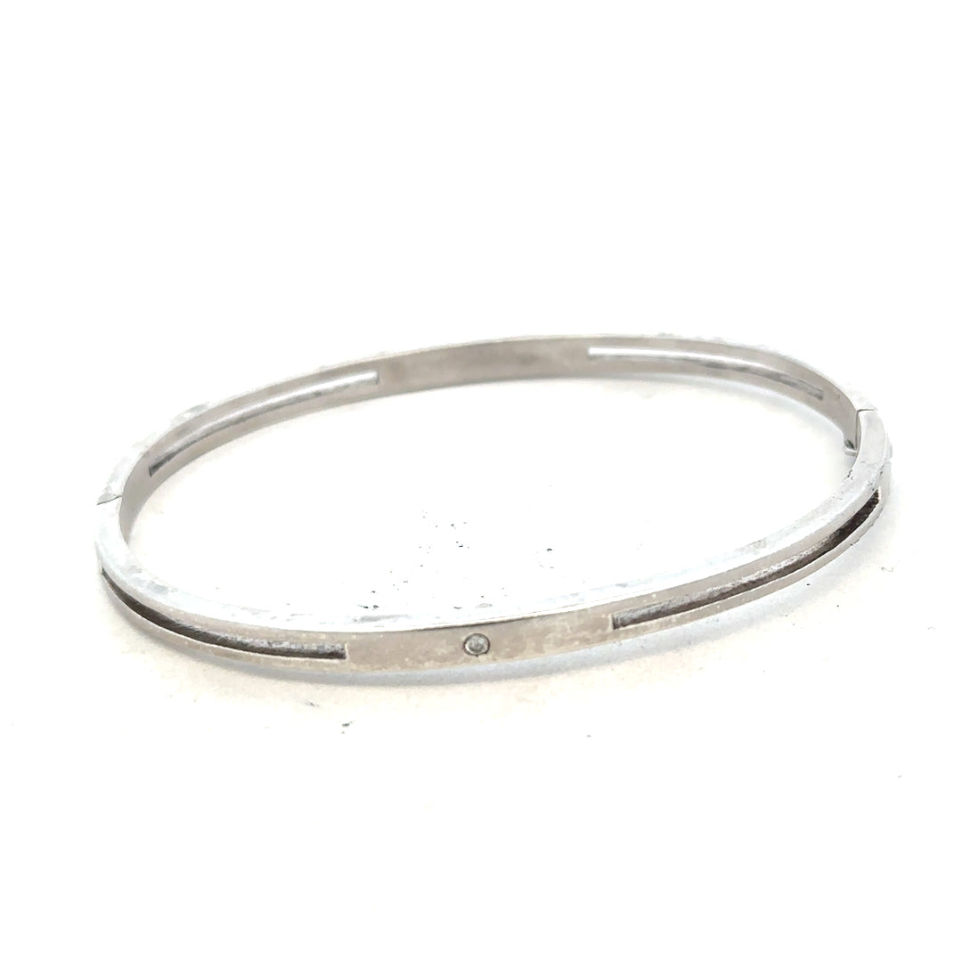 Silver bangle weighing 13.5g with intricate design, perfect for stylish jewelry collection.