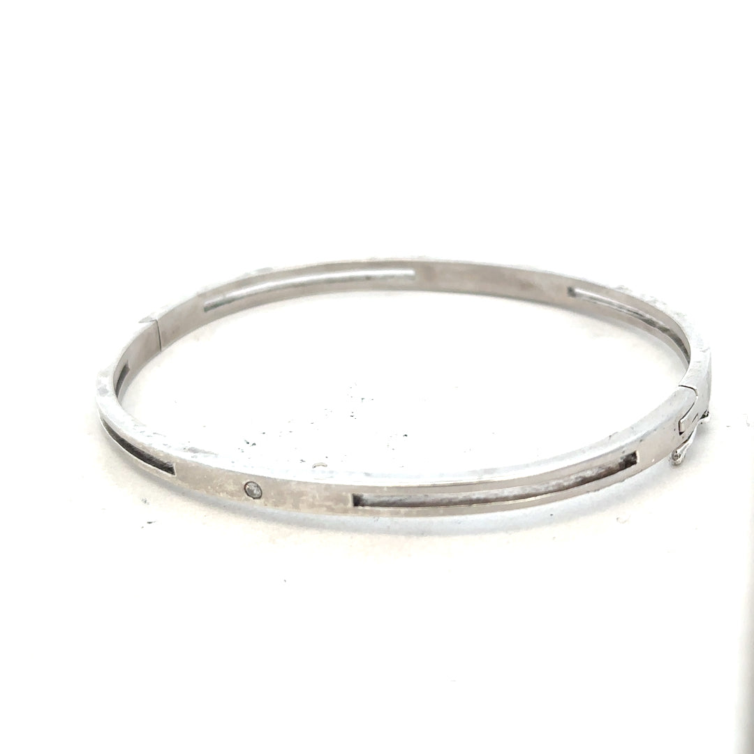 Silver bangle weighing 13.5g, unbranded, with a smooth, polished finish, displayed on a neutral background.