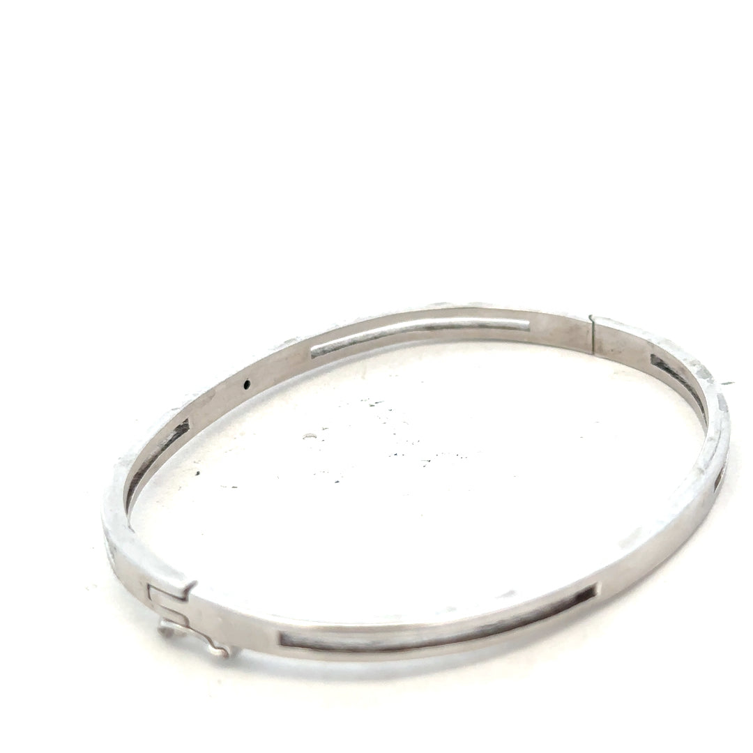 Silver bangle weighing 13.5g with a sleek, polished finish, designed for elegant wristwear.