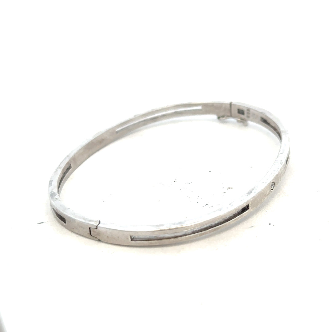 Silver bangle weighing 13.5g with a sleek, polished design, perfect for everyday wear or special occasions.