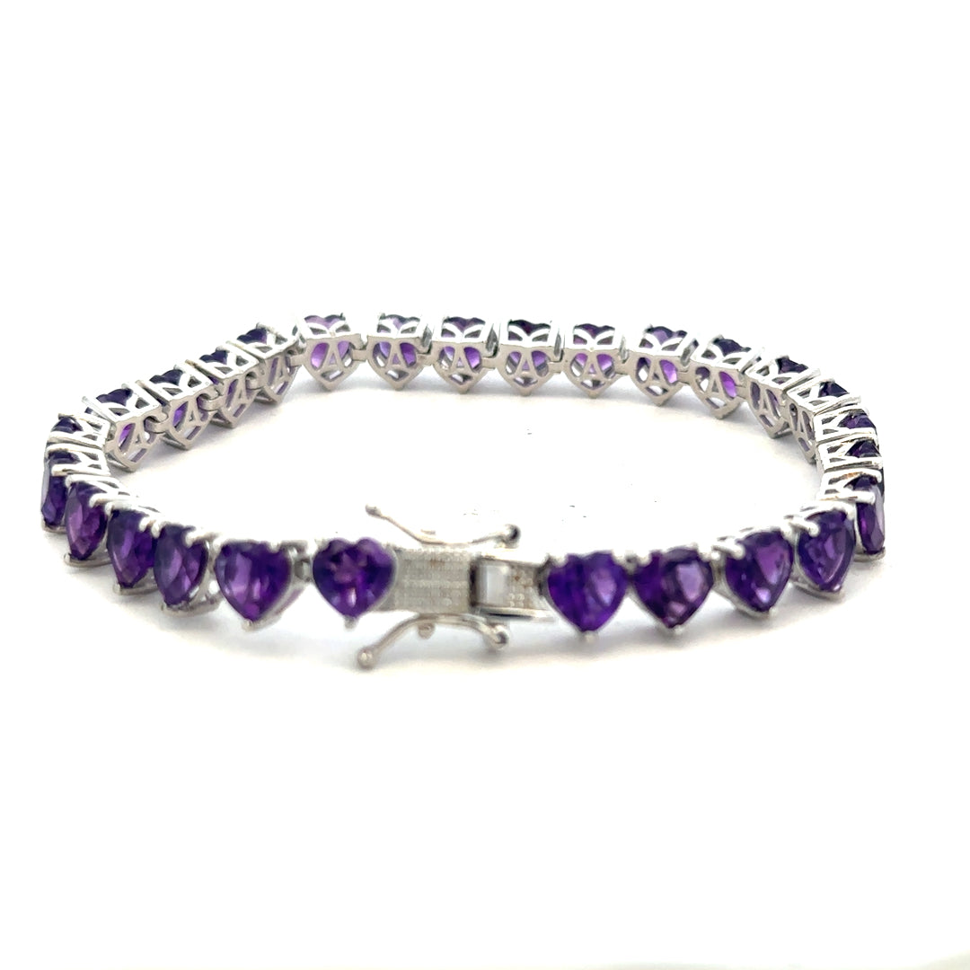 Silver bracelet weighing 14.7g with a sleek, polished design, displayed on a neutral background.