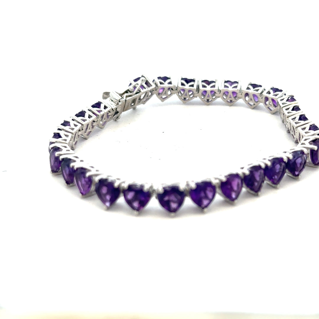 Silver bracelet weighing 14.7g with a sleek, smooth design, displayed on a neutral background.
