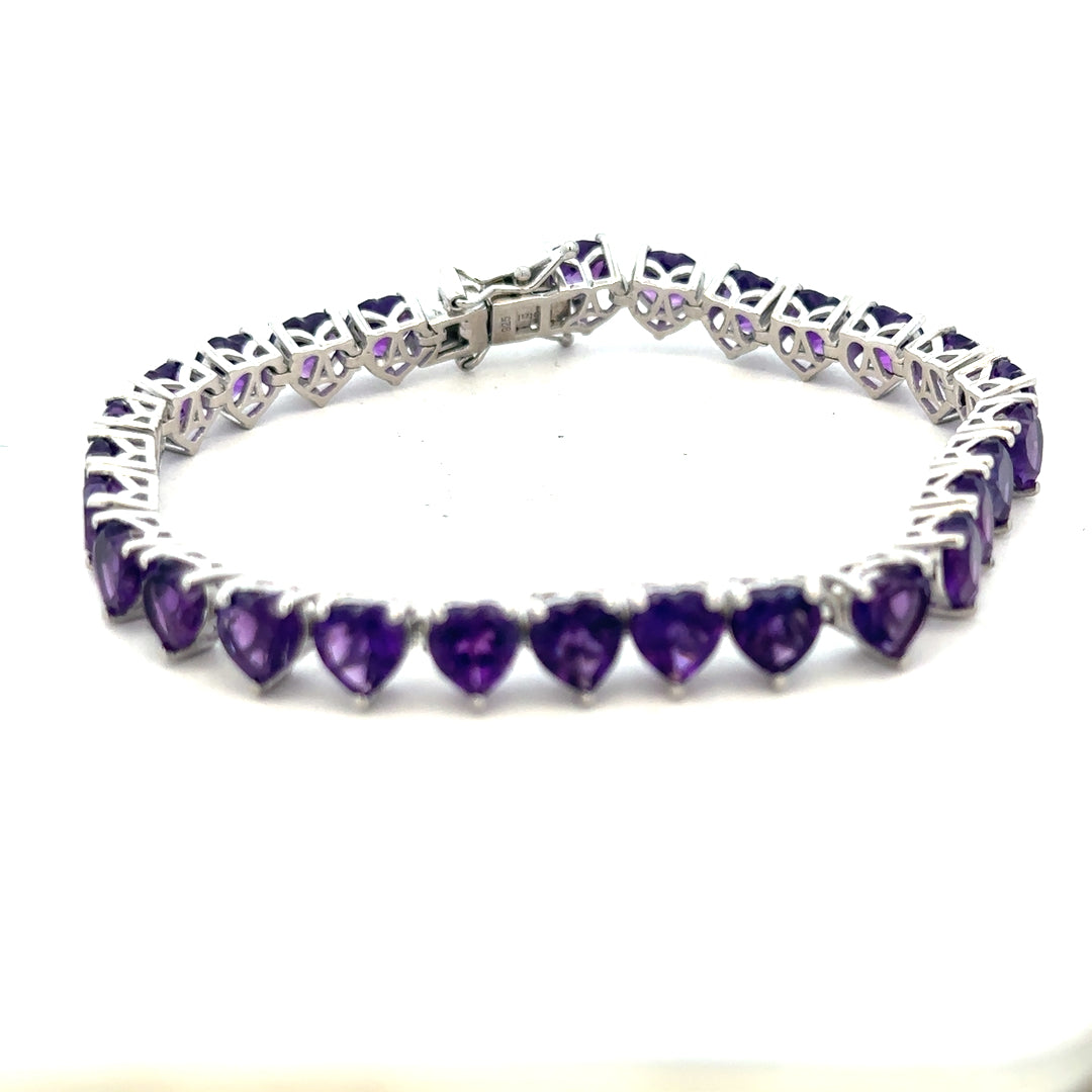 Silver bracelet weighing 14.7g with a sleek, polished finish, featuring a simple, elegant design suitable for stylish accessories.