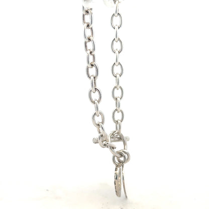 Silver bracelet weighing 19.5g with intricate design, featuring a polished finish and secure clasp.