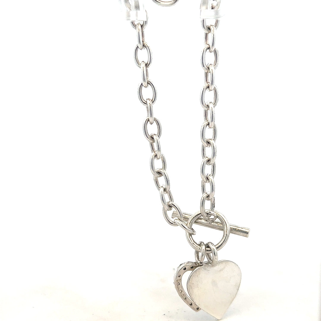 Silver bracelet weighing 19.5g with intricate design, showcasing craftsmanship and polished finish.