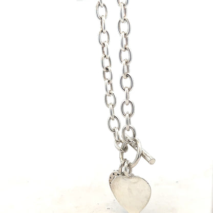 Silver bracelet weighing 19.5g with intricate design, featuring a smooth polished finish and a secure clasp.