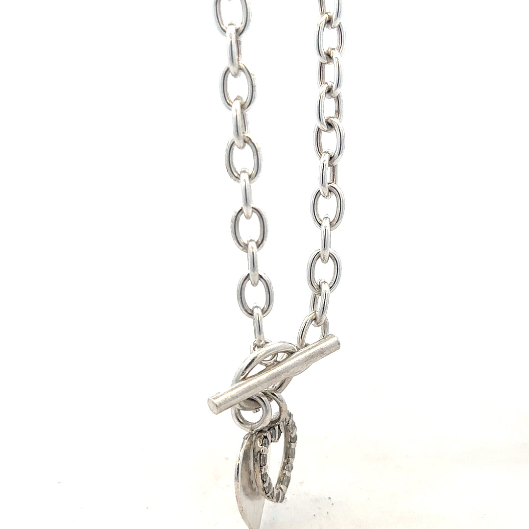 Silver bracelet weighing 19.5g with intricate design, unbranded jewelry piece displayed on a neutral background.