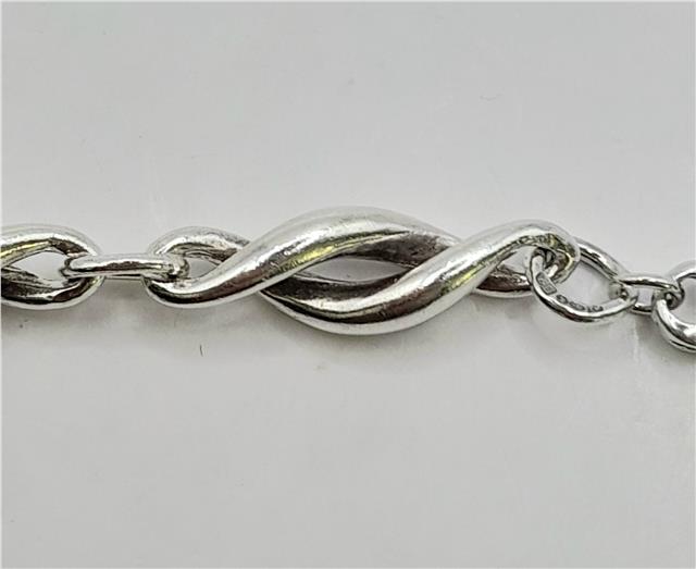 Silver bracelet, 19cm length, 14.4g, unbranded, stylish jewelry with a smooth, polished finish.