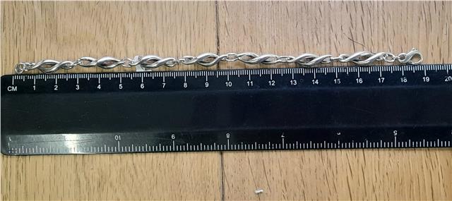 Silver bracelet measuring 19cm and 14.4g, unbranded, featuring a sleek, polished design suitable for everyday wear