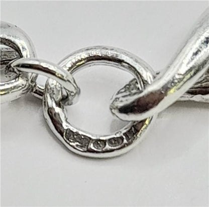 Silver bracelet, 19cm length, 14.4g, unbranded, with a sleek polished finish, displayed on a neutral background.