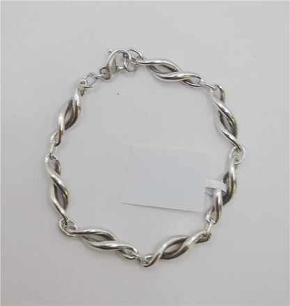 Silver bracelet measuring 19cm and weighing 14.4g, featuring a sleek unbranded design, shown on a plain background.
