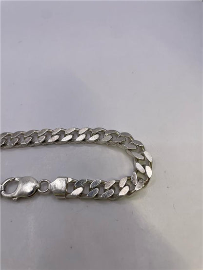 Silver bracelet weighing 33.8g with a sleek design, perfect for stylish accessories and everyday wear.