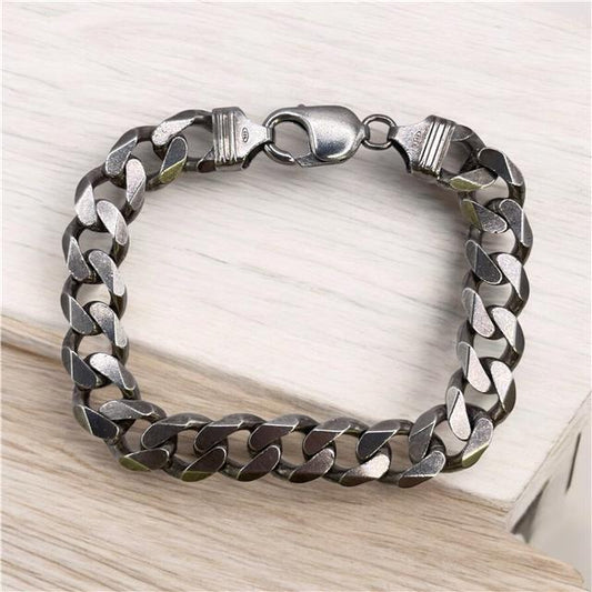 Silver bracelet weighing 34.5g with a sleek, polished finish, featuring a simple, elegant design for everyday wear.