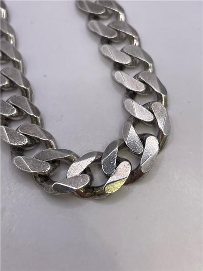 Silver bracelet weighing 34.5g with a sleek, polished finish, featuring a classic design and unbranded style.