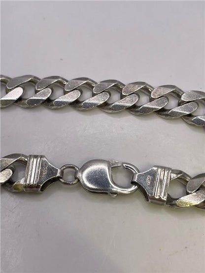 Silver bracelet weighing 34.5g with intricate design, unbranded, shown on a neutral background.