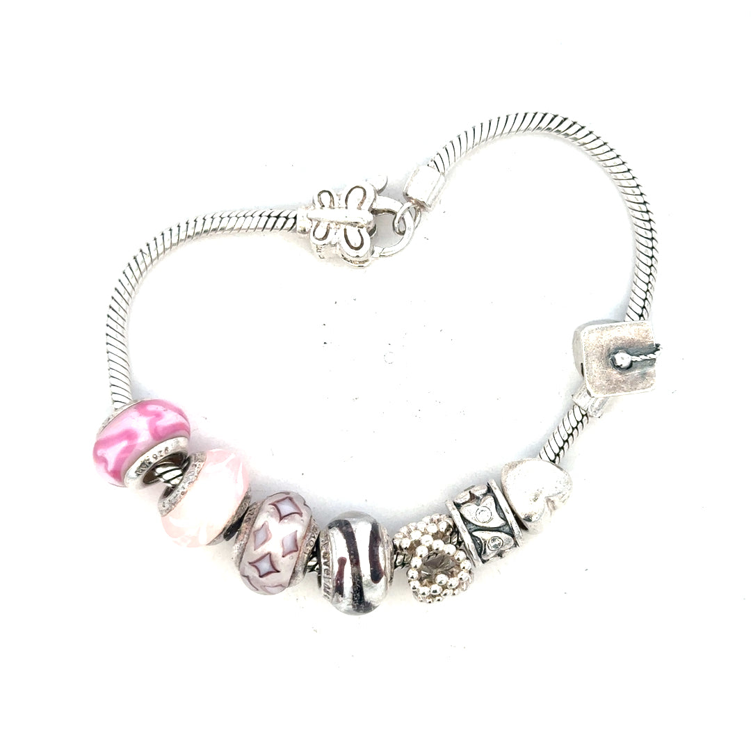 Silver bracelet weighing 37g with intricate design, unbranded jewelry piece shown on a neutral background.