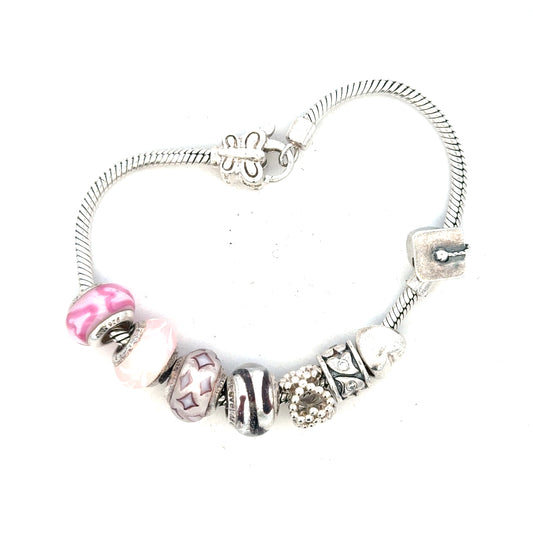 Silver bracelet weighing 37g with intricate design, unbranded jewelry piece shown on a neutral background.