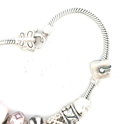 Silver bracelet weighing 37g with a sleek, polished design, featuring a smooth band and subtle shine.
