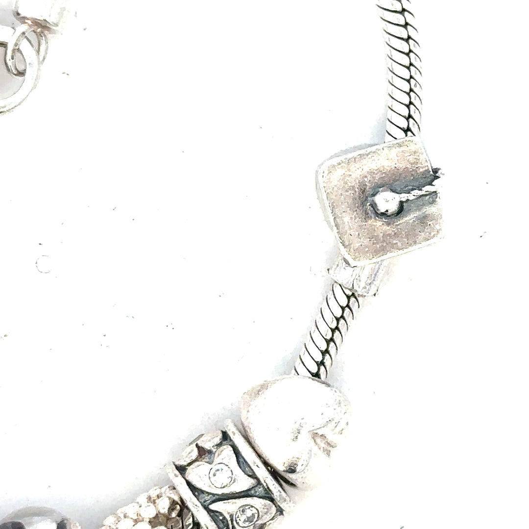 Silver bracelet weighing 37g with intricate design, featuring a sleek and polished finish, perfect for stylish everyday wear.