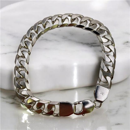 Silver bracelet weighing 47g with intricate design, crafted from unbranded sterling silver, displayed on a neutral background.