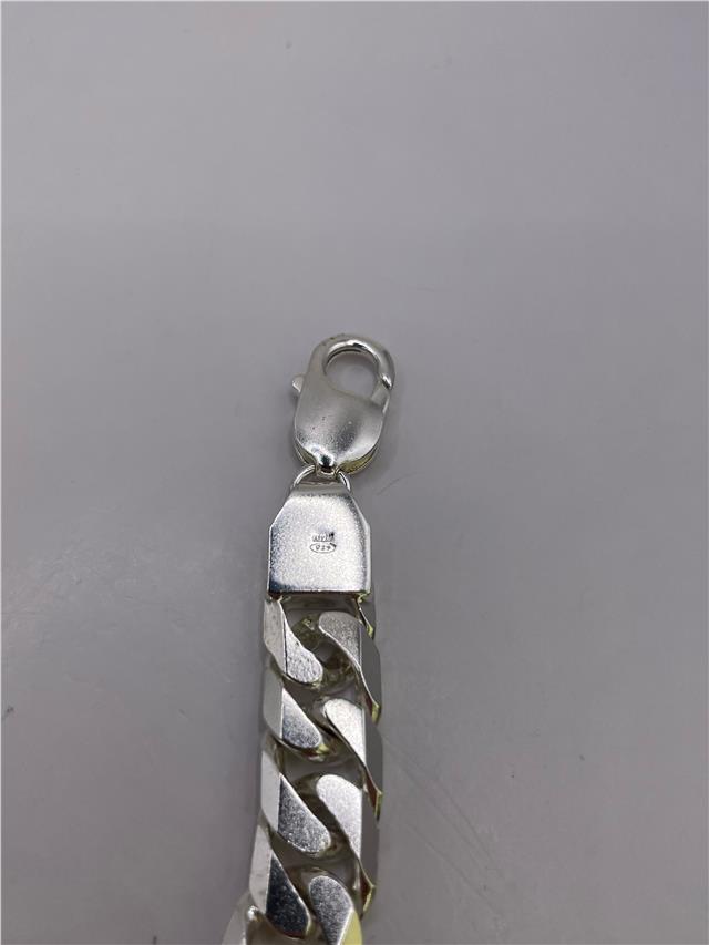 Silver bracelet weighing 47g with intricate design, featuring a polished finish and secure clasp, unbranded jewelry accessory.