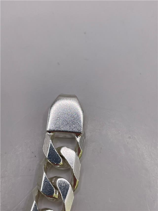 Silver bracelet weighing 47g with intricate design, crafted for stylish wear, shown on a neutral background.