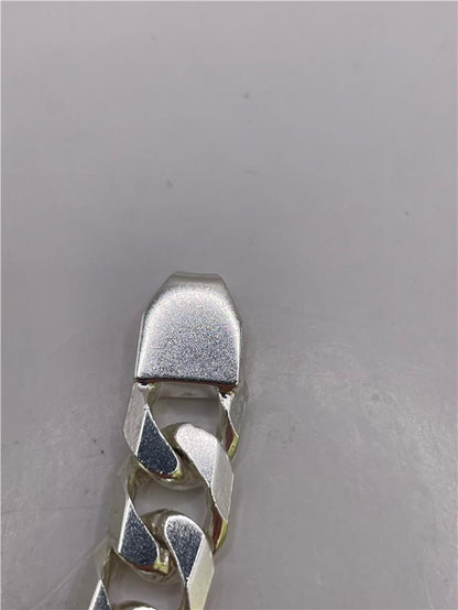 Silver bracelet weighing 47g with intricate design, crafted for stylish wear, shown on a neutral background.