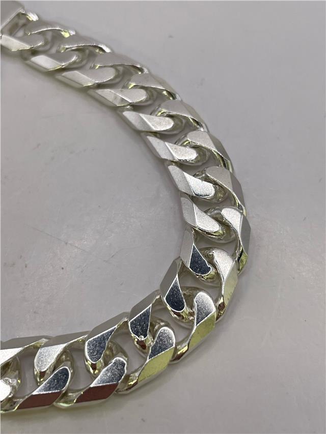 Silver bracelet weighing 47g with intricate design, crafted from unbranded metal, shown in a close-up image.