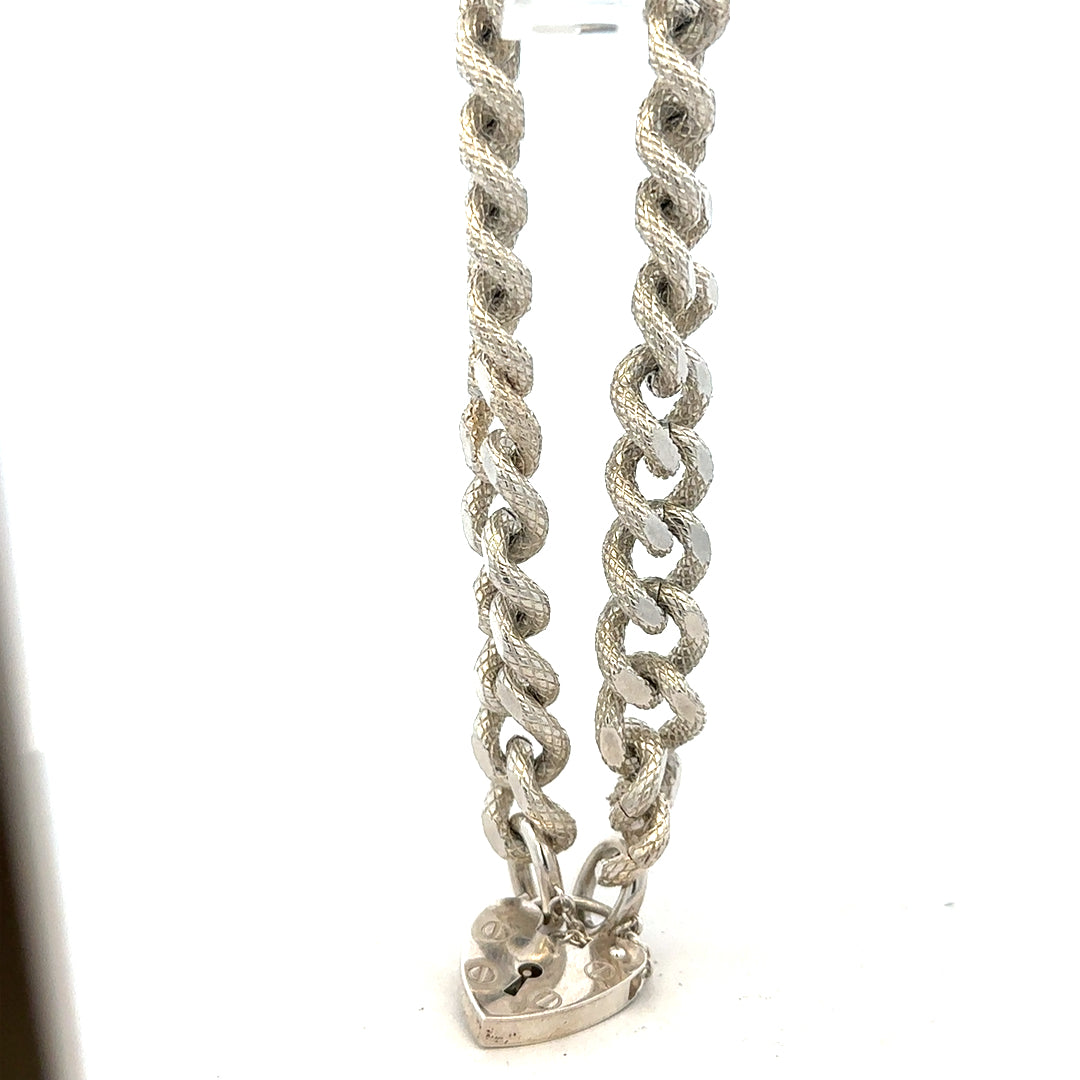Silver bracelet weighing 64.4 grams with a sleek, polished finish, featuring a classic design perfect for everyday wear.