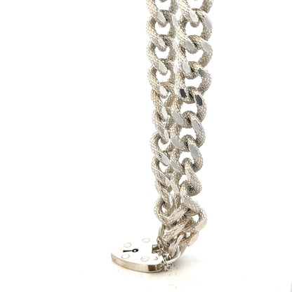 Silver bracelet weighing 64.4g with a sleek, polished finish, designed for stylish wrist wear.