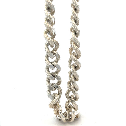 Silver bracelet weighing 64.4g with intricate design, unbranded jewelry piece shown on a neutral background.