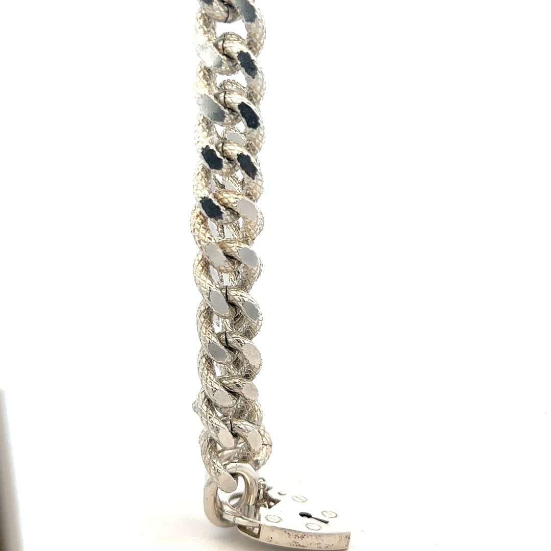 Silver bracelet weighing 64.4g with a sleek design, unbranded jewelry piece shown on a clean background.